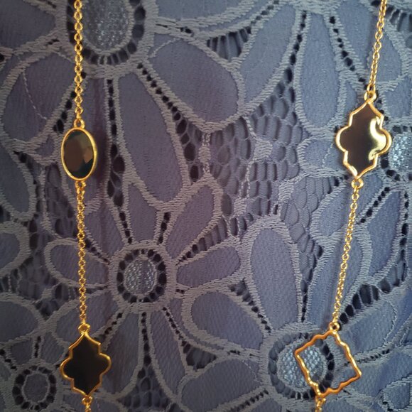 Four leaf clover with gold tone necklace. - Picture 2 of 3